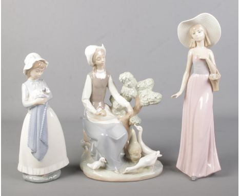 A collection of three Nao figures.  