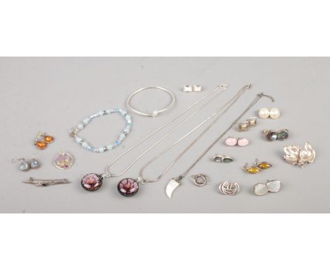 A collection of vintage marked silver jewellery, to include mother of pearl tooth and resin pendants on chain, leaf brooch, s