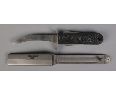 An RAF MkIII flying suit survival knife, with cover. Bearing broad arrow mark, 22C/4466607.  CANNOT POST