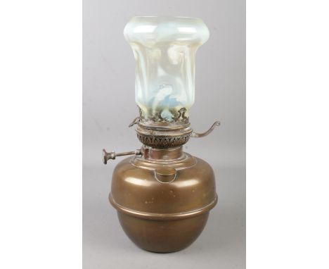 A Veritas oil lamp with vaseline glass shade.  