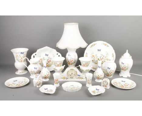 A large quantity of Aynsley fine bone china in the 'Cottage Garden' design. To include table lamp, vases, owl, plates and qua