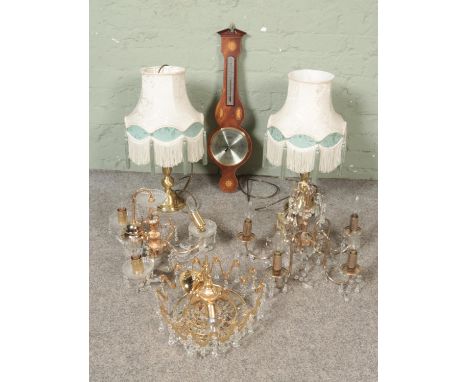 A quantity of lighting including ceiling lights and two brass table lamps together with a modern barometer  