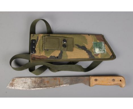 A British military Martindale No.2 Golok machete bearing broad arrow mark to blade. Includes later camo sheath dated 1998. CA