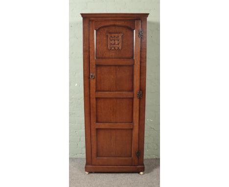 A single door oak wardrobe/hall cupboard with iron gate design to front Hx182cmWx72cmDx43cm  