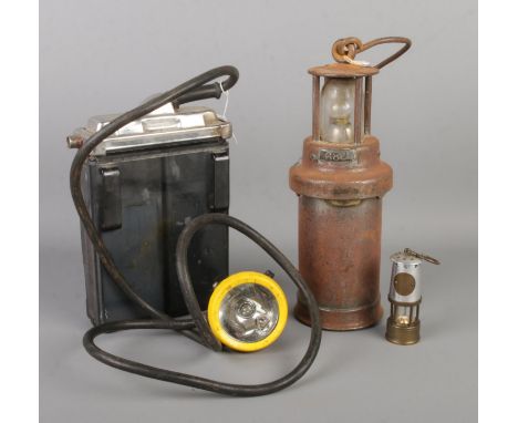 Three pieces of mining memorabilia, to include CEAC miner's lamp 680, miniature miner's lamp and Oldham T light.  