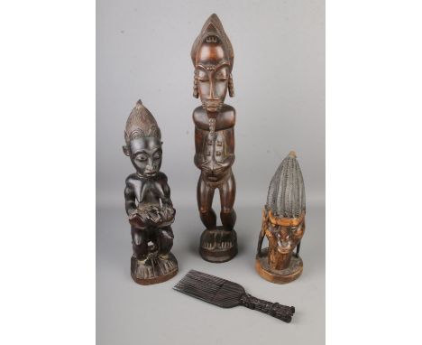 A collection of tribal figures including a tribal comb.  
