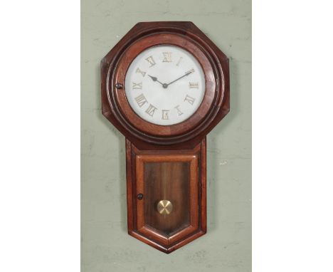 A antique mahogany cased drop dial wall clock. Featuring replacement octagonal face and Hermle quartz movement.  
