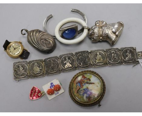 A white metal filligree bracelet, two white metal child's rattles, a pair of coral mounted ear studs, a bangle and a limoges 
