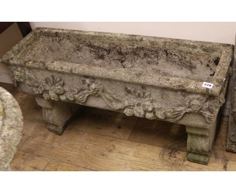 A composition stone trough W.90cm