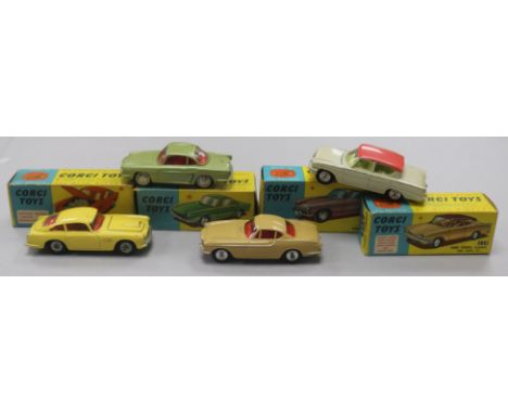 A Corgi Toys Aston Martin D.B.4 No. 218 and three other boxed Corgi cars, including Renault 'Floride' No. 222 (tear to box an