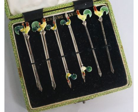 A set of ten sterling silver and enamel cocktail sticks with cockerel terminals.