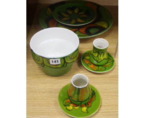 A Poole pottery green ground large dish, no 5, three smaller dishes, a bowl and two small vases