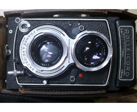 A cased Rolleicord camera