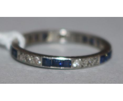 A platinum sapphire and diamond set full eternity ring, size M.