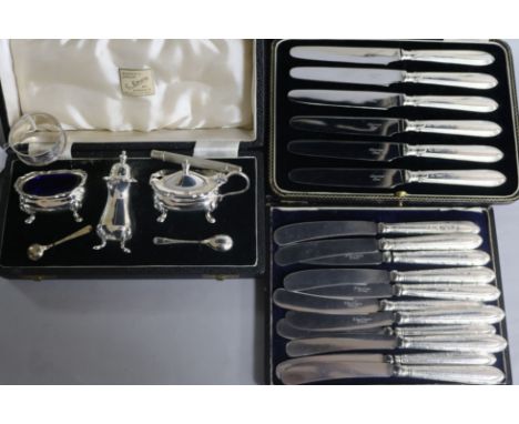 Three cased sets including silver handles knives and a silver napkin ring.