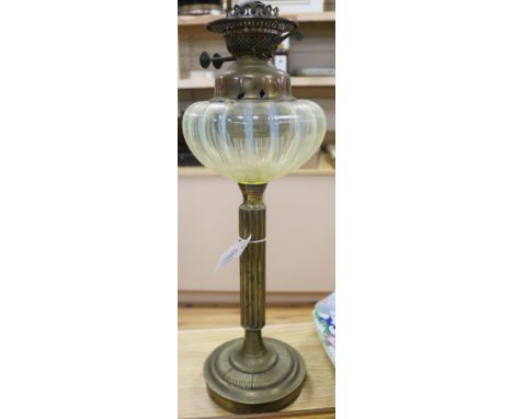 A Victorian brass oil lamp with vaseline glass reservoir