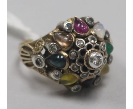 A gold and multi gem set dome topped dress ring, size P.