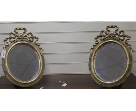 A pair of gilt easel mirrors