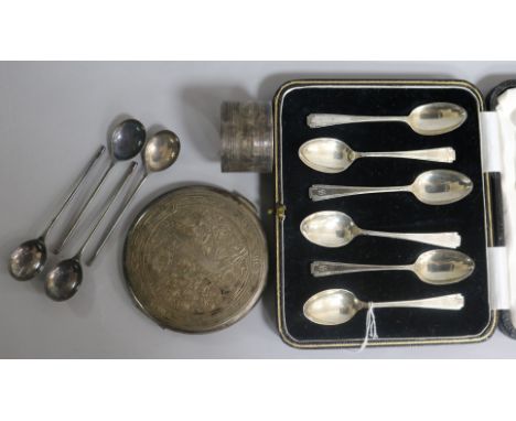 A cased set of six Art Deco silver teaspoons, an Egyptian silver compact, a silver napkin ring and four plated teaspoons.