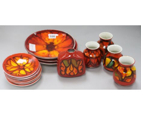 Three Poole pottery red ground dishes, seven smaller dishes and five assorted vases