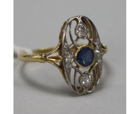 An early 20th century Art Nouveau gold, sapphire and diamond set oval dress ring, size Q.