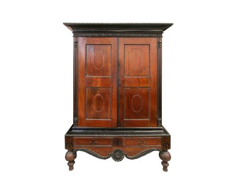 A Sri Lankan ebony and padauk wood cabinet, probably from the second quarter of the 19th century, with a bobbin, moulded over