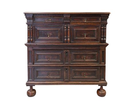 A late 17th-century walnut and oak two-section four-drawer chest of drawers. with split bobbin appliques and the drawers with