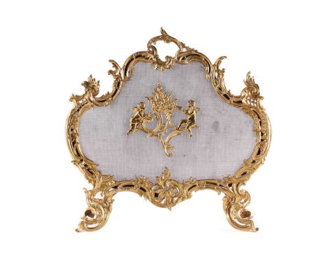 A Louis XV style gilt metal firescreen, of shaped foliate scroll design to the centre depicting two cherubs stoking a fire, o