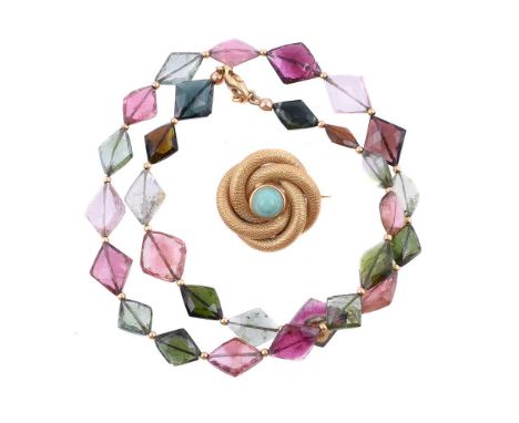 A 1960s Italian turquoise and gold coloured brooch by Carlo Weingrill, the mesh knot brooch centred with a circular cabochon 