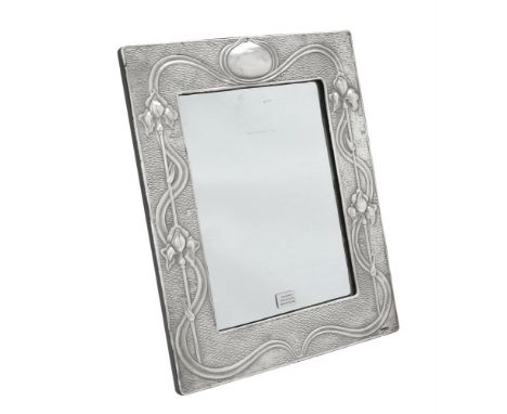 A silver mounted rectangular photo frame by Ray Hall, Birmingham circa 2000, chased with Art Nouveau flower decoration and an