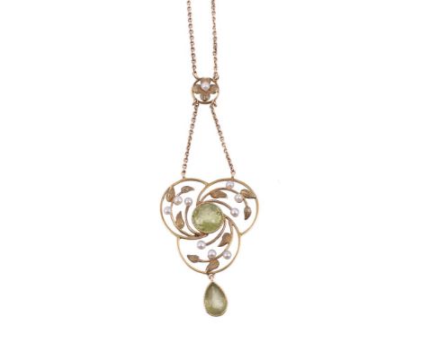 An Edwardian peridot and seed pearl pendant necklace, the pierced trefoil panel with a central circular cut peridot within a 
