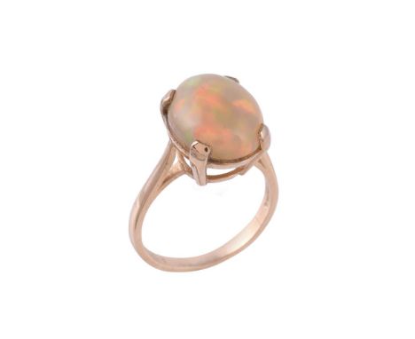 A single stone opal ring, the oval cabochon opal within a four claw setting, opal approximately 13mm long, with partial 9 car