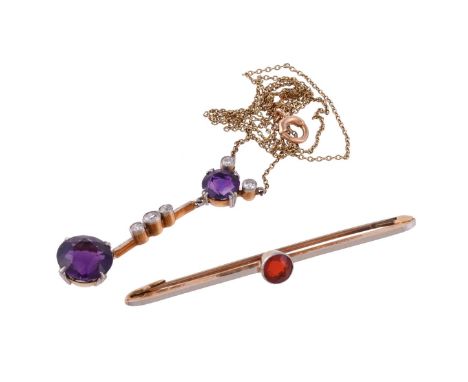 An Edwardian amethyst and diamond pendant, circa 1910, the circular cut amethyst drop suspended from a knife edge bar set wit