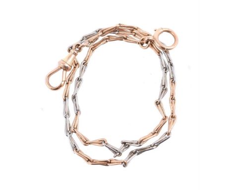 A two colour Albert chain, the fancy link chain to lobster claw and ring bolt clasps, stamped 18ct, 34cm long, 11.4g Conditio