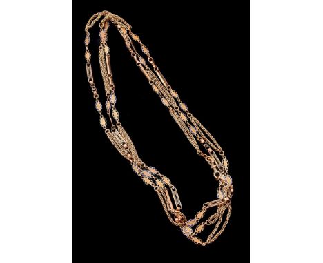 A gold coloured blue enamel fancy link long chain, the chain composed of pierced decorative bars flanked by navette shaped pa