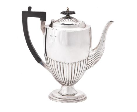 A late Victorian silver half gadrooned coffee pot by Walker & Hall, Sheffield 1898, with a wood finial and angular handle, on