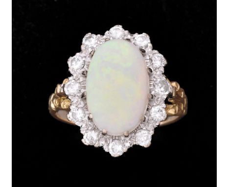 An opal and diamond cluster ring, the oval cabochon opal claw set within a surround of brilliant cut diamonds, approximately 