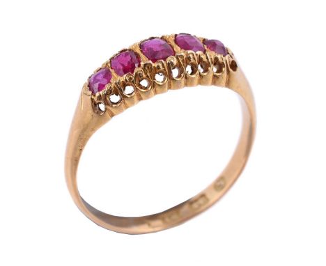 An 18 carat gold Victorian five stone ruby ring, the five graduated cushion cut rubies to a pierced gallery, hallmarked Birmi