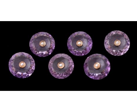 A suite of six Late Victorian amethyst and seed pearl buttons, circa 1890, the circular facetted amethyst panels each centred