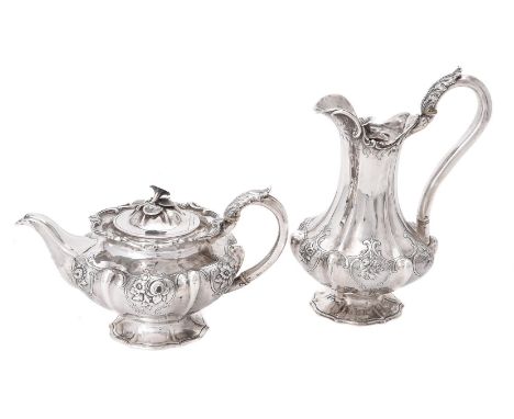 Y A Victorian silver lobed circular tea pot and hot water pot by Benjamin Smith III, London 1840, the tea pot with a floral f