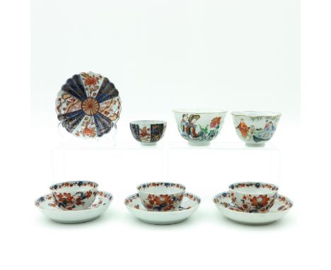 Including 6 cups and 4 saucers in diverse polychrome decors, largest cup is 10 cm. in diameter, chip and hairline.