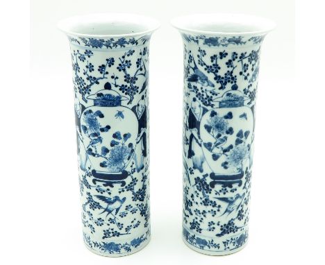Depicting Chinese figures holding vases, Kangxi mark, 35 cm. tall, chip.