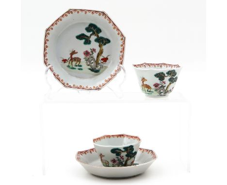 Depicting deer in garden, saucers are 11 cm. in diameter, chip.
