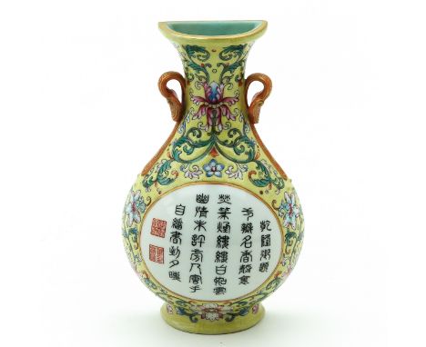 Yellow ground decorated with flowers in Famille Rose enamels, Chinese text and seal marks in center of wall vase, Qianlong ma