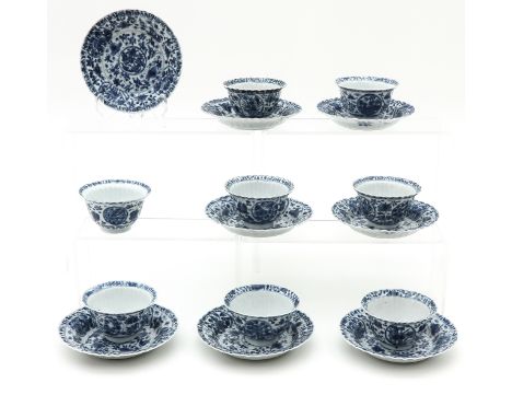Blue and white floral decor, marked with double ring and sacred fungus, saucers are 14 cm. in diameter, chip.
