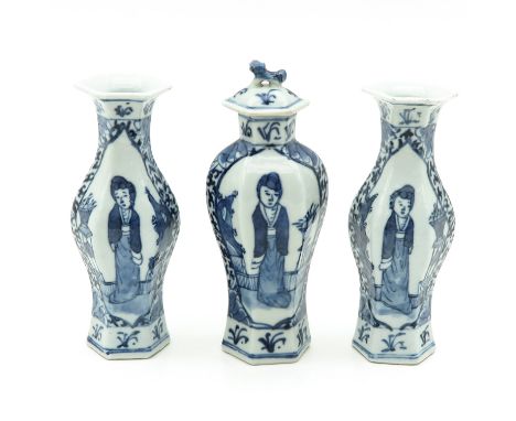 Decorated with Chinese figures, tallest vase is 18 cm., Kangxi mark, chip .