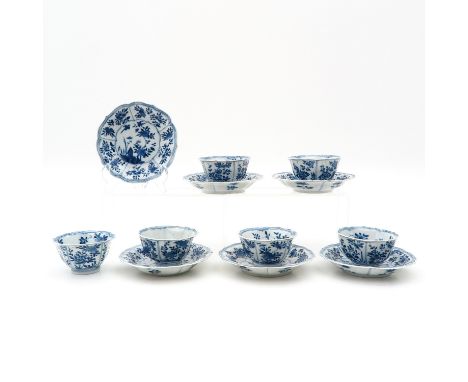 Floral decor, marked with double ring and flower, saucers are 13 cm. in diameter, chip and hairline.