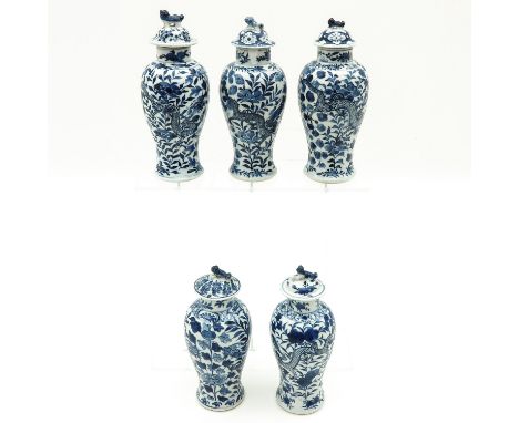 Floral decor, tallest vase is 23 cm. tall, including Kangxi mark, chip.