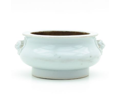 On raised circular base, 18th Century, Kangxi Period, temple lion handles, 13 cm. in diameter x 6 cm. tall. 