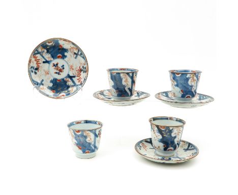 Floral decor in iron red, blue and gilt, saucers are 14 cm. in diameter, chip and hairline.